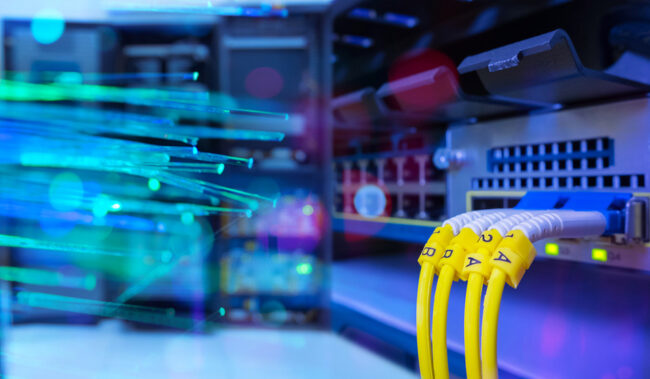 Fiber optic cable and Network switch 24 port gigabit blending with fiber optic cable and lighting of fiber optics in network center room